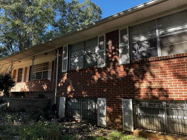 Brick ranch with a standing seam metal roof